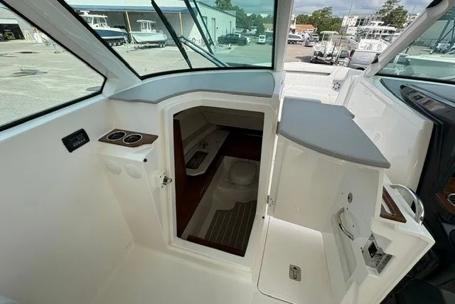 Slide: The Image of 2027 Tiara Yachts 34 LX cabin interior with modern amenities and sleek design. - 14