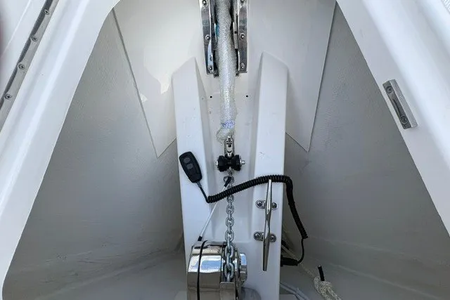 Slide: The Image of Anchor system on 2027 Tiara Yachts 34 LX, featuring chain and winch mechanism. - 29