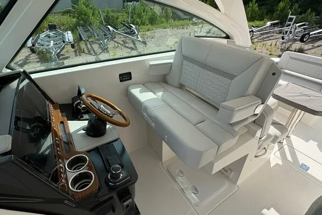 Slide: The Image of 2027 Tiara Yachts 34 LX helm with luxurious seating and modern controls. - 22