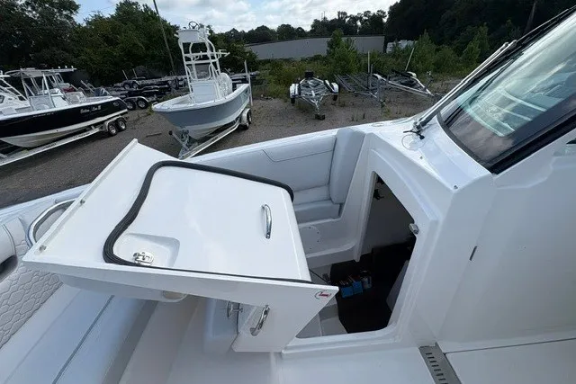 Slide: The Image of 2027 Tiara Yachts 34 LX boat interior with open storage compartment. - 31