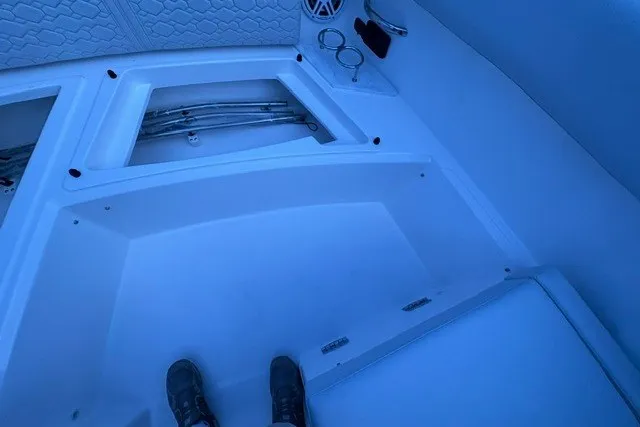 Slide: The Image of Interior view of 2027 Tiara Yachts 34 LX, showcasing storage compartments and speaker. - 28