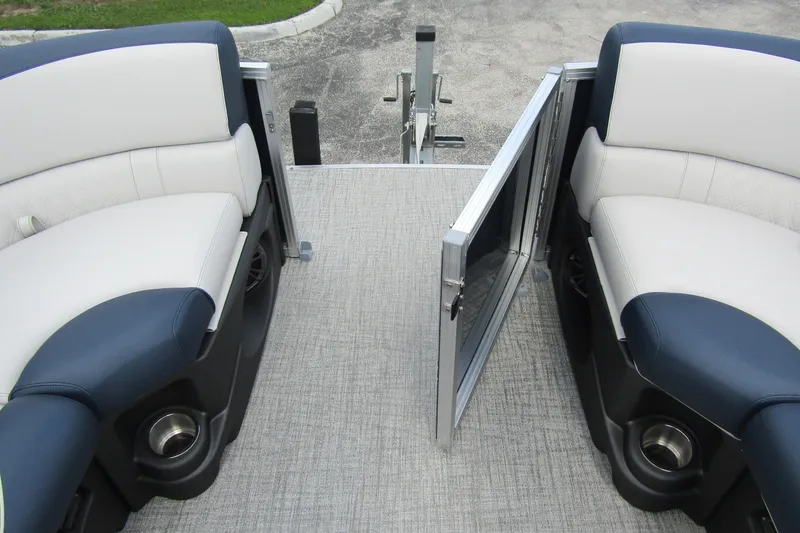 Slide: The Image of 2026 Tahoe Pontoon LTZ Versatile Rear Bench with open wind shield, showcasing seating area. - 8