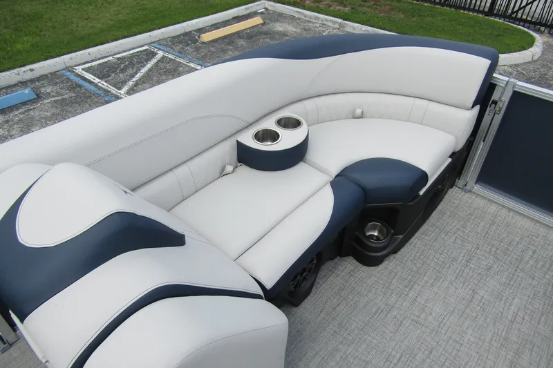 Slide: The Image of Luxurious seating on 2026 Tahoe Pontoon LTZ Versatile Rear Bench Wind Shield 23 with cup holders. - 10