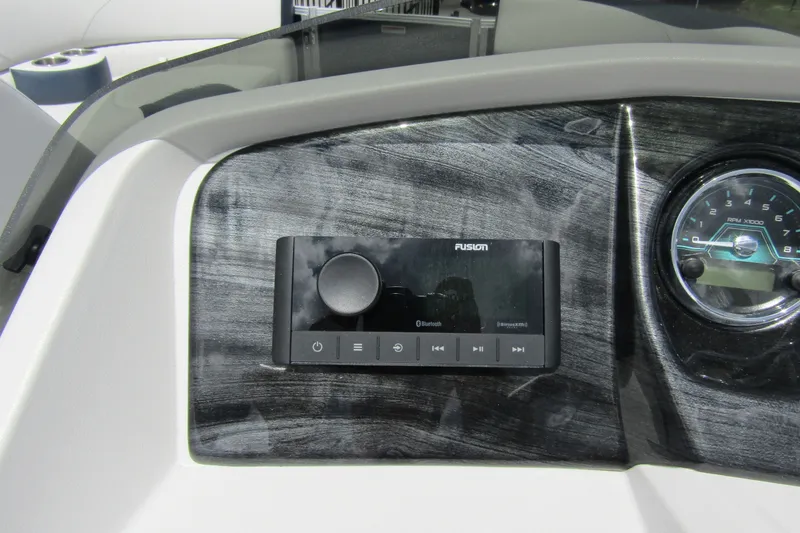 Slide: The Image of Dashboard of 2026 Tahoe Pontoon LTZ with Fusion audio system and RPM gauge. - 17