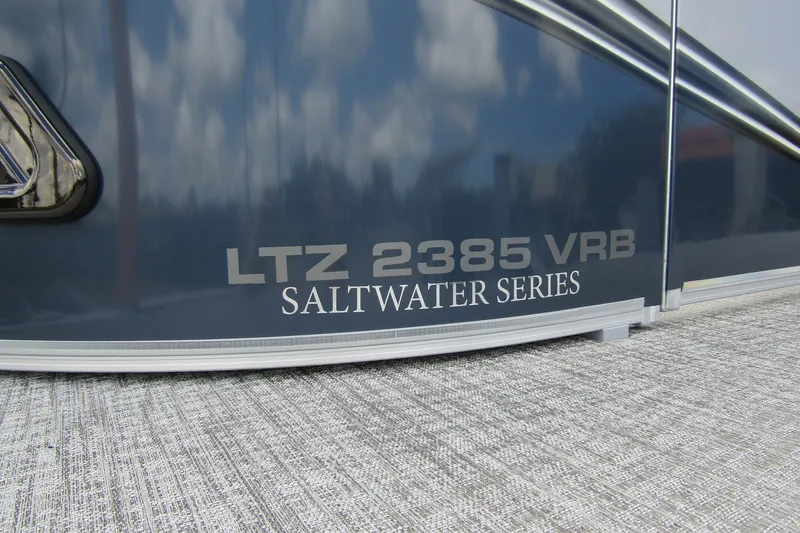 Slide: The Image of 2026 Tahoe Pontoon LTZ Versatile Rear Bench, Saltwater Series branding detail. - 7