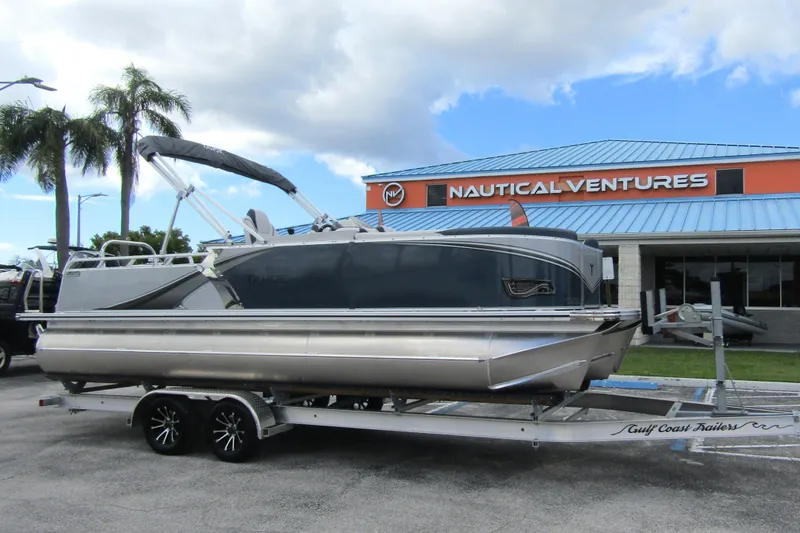 Slide: The Image of 2026 Tahoe Pontoon LTZ Versatile Rear Bench Wind Shield 23 at Nautical Ventures dealership. - 5