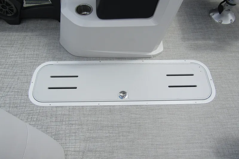 Slide: The Image of 2026 Tahoe Pontoon LTZ Versatile Rear Bench Wind Shield 23 deck detail with storage compartment. - 13