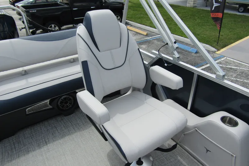 Slide: The Image of 2026 Tahoe Pontoon LTZ Versatile Rear Bench Wind Shield 23 interior with plush seating. - 23