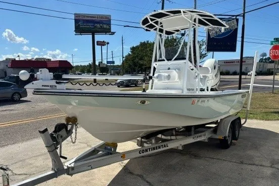 The Image of 2020 K2 Marine Frontier 2104 boat on trailer, parked outdoors under clear sky. - 1