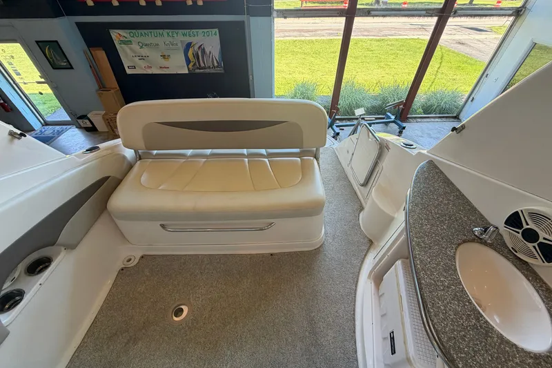 Slide: The Image of Interior of 2008 Chaparral Signature 270 boat with seating and kitchenette area. - 15