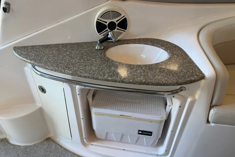 Slide: The Image of 2008 Chaparral Signature 270 boat interior with sink, countertop, and storage compartment. - 18