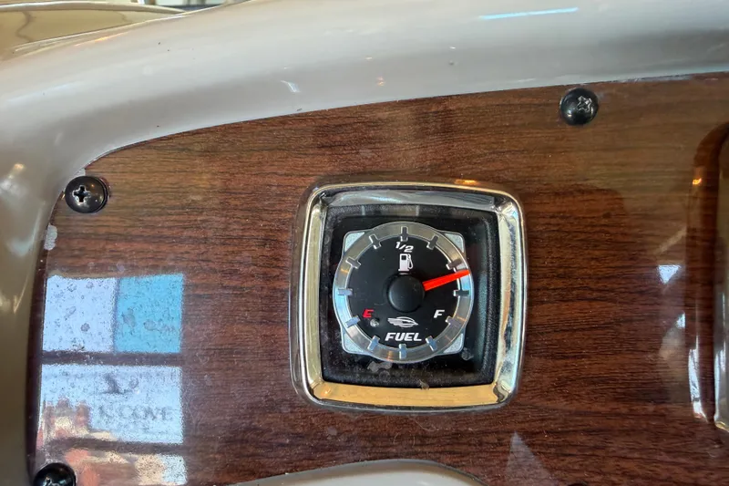 Slide: The Image of Fuel gauge on 2008 Chaparral Signature 270 dashboard with wood finish. - 20
