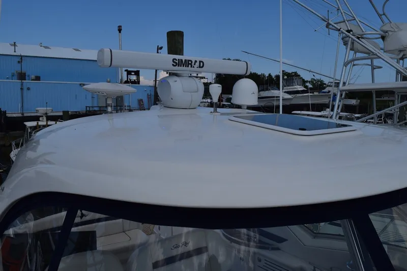 Slide: The Image of 2004 Sea Ray 390 Sundancer yacht with radar equipment on top deck. - 11