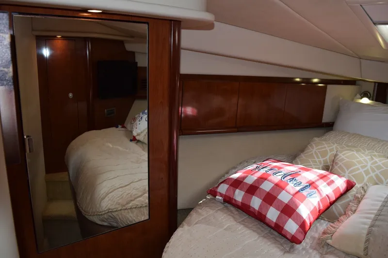 Slide: The Image of Luxurious cabin interior of 2004 Sea Ray 390 Sundancer yacht with cozy bedding. - 30