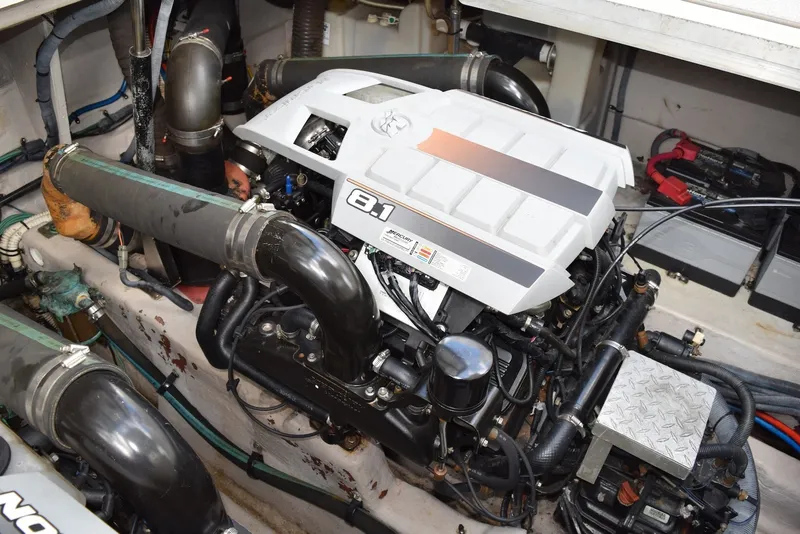 Slide: The Image of Engine compartment of a 2004 Sea Ray 390 Sundancer, featuring an 8.1 engine. - 43