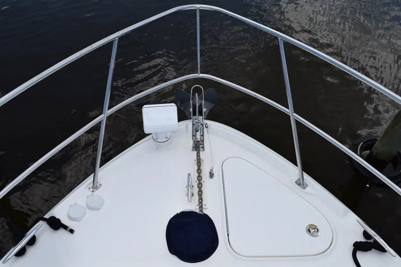 Slide: The Image of Bow view of 2004 Sea Ray 390 Sundancer yacht with anchor and railing. - 8
