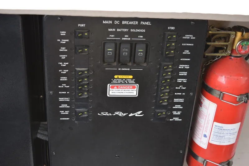 Slide: The Image of Main DC breaker panel of 2004 Sea Ray 390 Sundancer with fire extinguisher. - 41