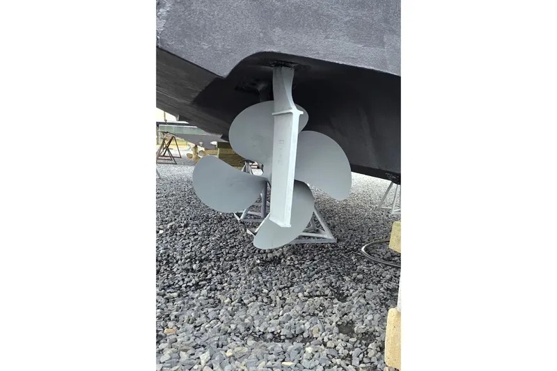 Slide: The Image of Propeller of 2004 Sea Ray 390 Sundancer on gravel surface. - 44