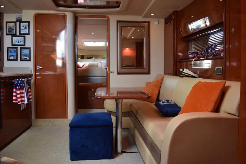 Slide: The Image of Interior of 2004 Sea Ray 390 Sundancer yacht with cozy seating and elegant wood finishes. - 25