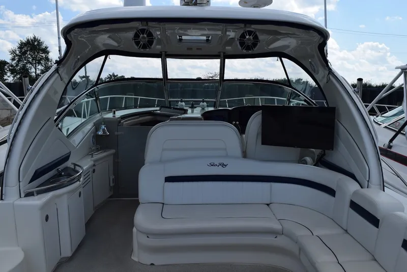 Slide: The Image of 2004 Sea Ray 390 Sundancer yacht interior with seating and entertainment area. - 22