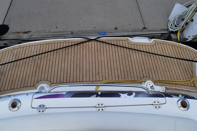Slide: The Image of 2004 Sea Ray 390 Sundancer swim platform with teak decking at dock. - 5