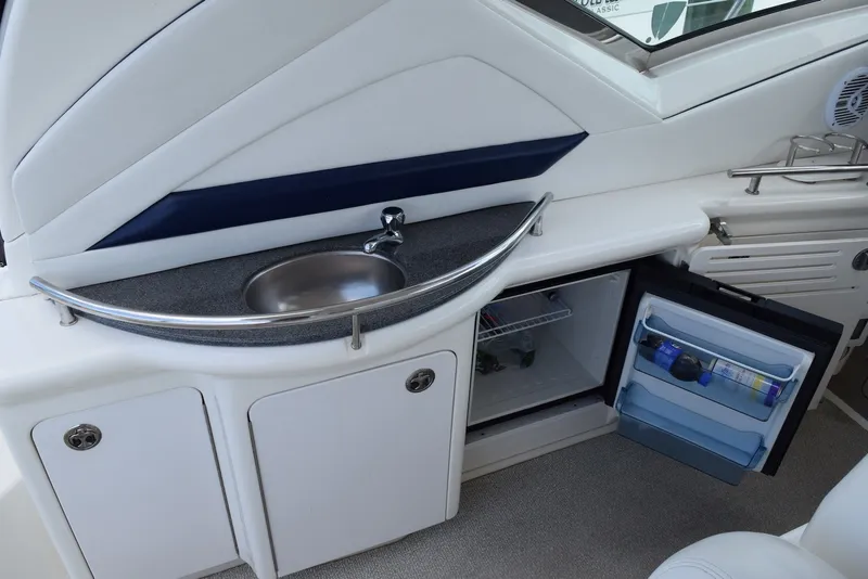 Slide: The Image of 2004 Sea Ray 390 Sundancer yacht interior with sink and mini fridge. - 15