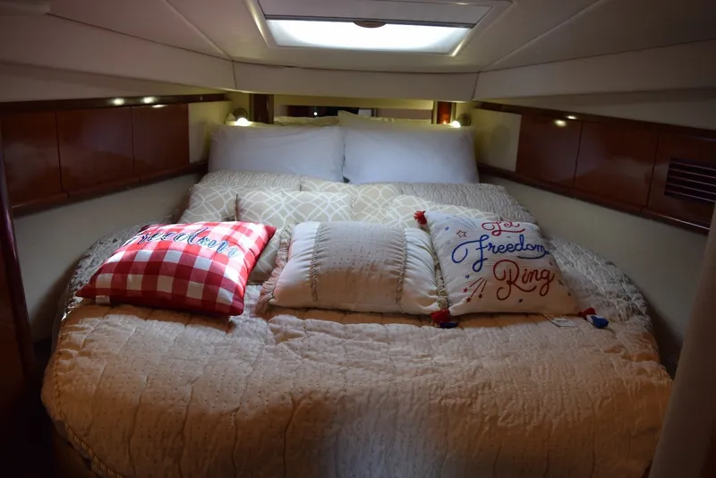 Slide: The Image of Cozy bedroom in 2004 Sea Ray 390 Sundancer yacht with decorative pillows. - 29