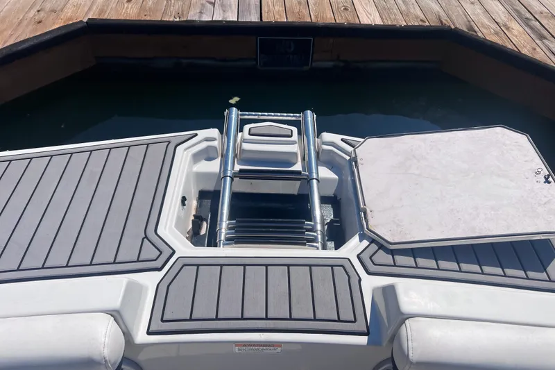 Slide: The Image of 2023 Starcraft SVX 210 IO boat swim platform with ladder and deck. - 5