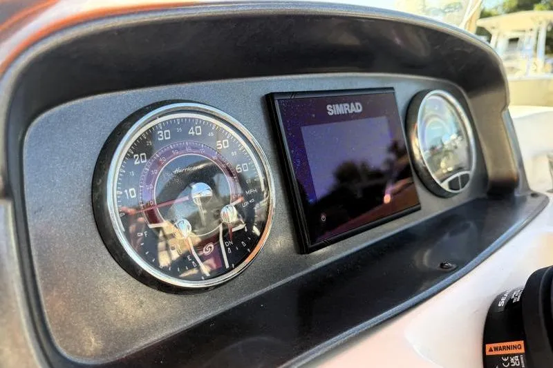 Slide: The Image of Dashboard of 2022 Hurricane SunDeck Sport 201 OB with Simrad display and gauges. - 25
