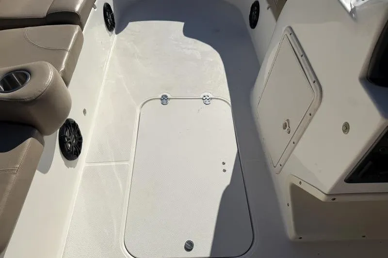 Slide: The Image of 2022 Hurricane SunDeck Sport 201 OB boat interior with seating and storage compartments. - 29