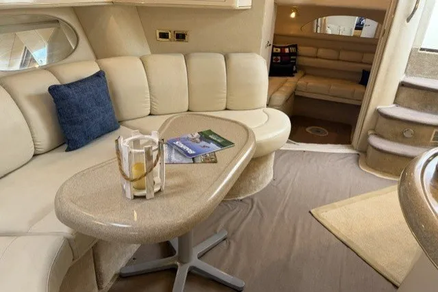 Slide: The Image of Luxurious interior of a 1997 Sea Ray Sundancer 400 yacht with plush seating and elegant decor. - 33