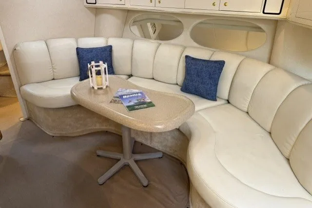 Slide: The Image of Luxurious interior of 1997 Sea Ray Sundancer 400 with plush seating and elegant decor. - 23