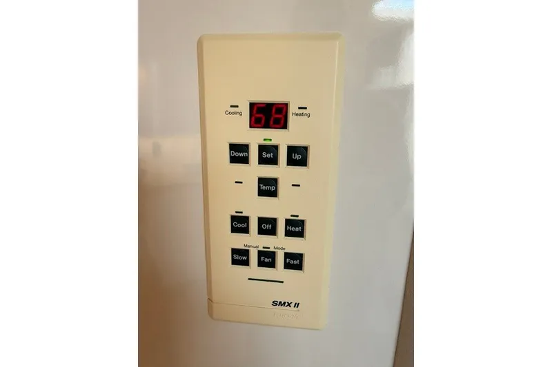 Slide: The Image of Control panel of a 1997 Sea Ray Sundancer 400, displaying temperature settings. - 27