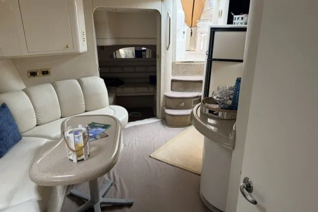 Slide: The Image of Interior of 1997 Sea Ray Sundancer 400 yacht with cozy seating and modern amenities. - 2