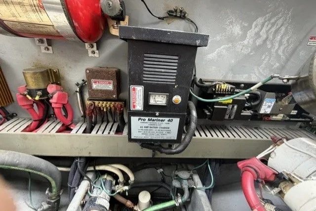Slide: The Image of Engine room of 1997 Sea Ray Sundancer 400 with Pro Mariner 40 battery charger. - 44