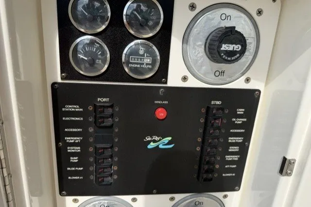 Slide: The Image of Control panel of a 1997 Sea Ray Sundancer 400 boat with gauges and switches. - 31