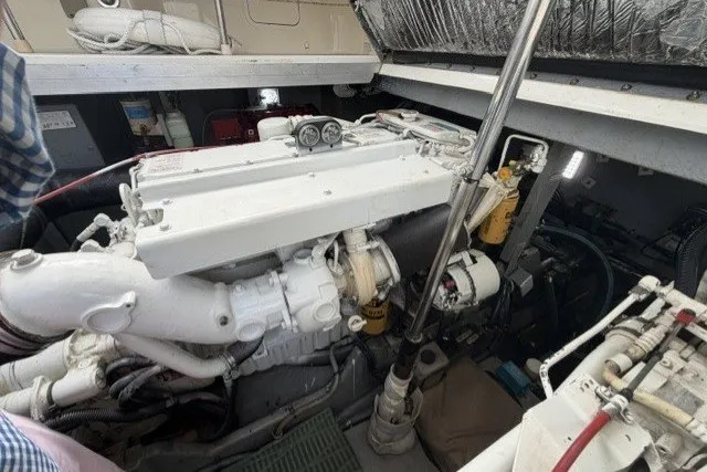 Slide: The Image of Engine room of a 1997 Sea Ray Sundancer 400 yacht, showcasing mechanical components. - 39