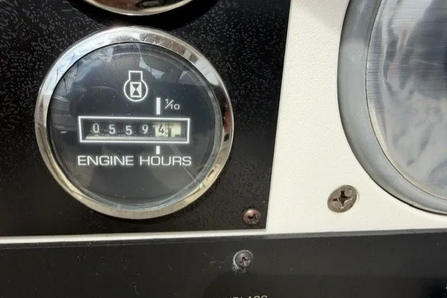 Slide: The Image of Engine hour meter showing 594.1 hours on 1997 Sea Ray Sundancer 400. - 46