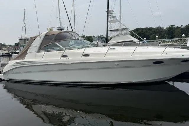 The Image of 1997 Sea Ray Sundancer 400 yacht docked at marina, side view. - 0