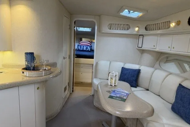 Slide: The Image of Interior of 1997 Sea Ray Sundancer 400 yacht with cozy seating and elegant decor. - 16