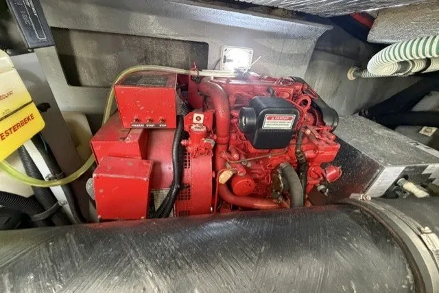 Slide: The Image of Engine compartment of a 1997 Sea Ray Sundancer 400 with a red Westerbeke generator. - 45