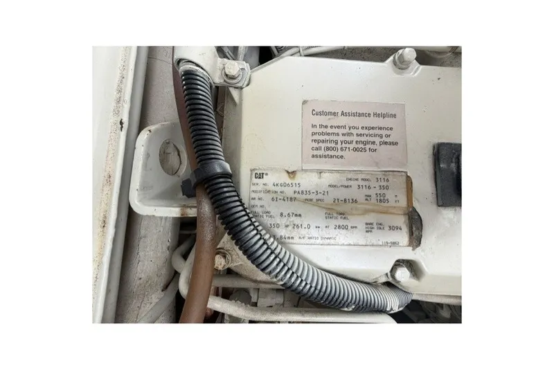 Slide: The Image of Engine compartment of a 1997 Sea Ray Sundancer 400 with CAT engine details. - 42