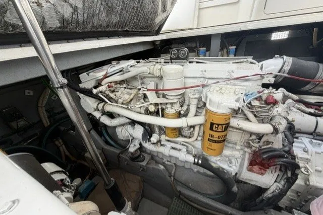 Slide: The Image of Engine compartment of a 1997 Sea Ray Sundancer 400 with visible CAT components. - 38