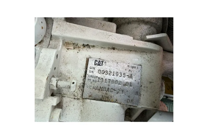 Slide: The Image of Close-up of a CAT engine part label on a 1997 Sea Ray Sundancer 400. - 37