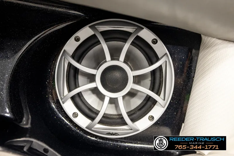 Slide: The Image of Close-up of a speaker in a 2013 Tigé RZR boat interior. - 42