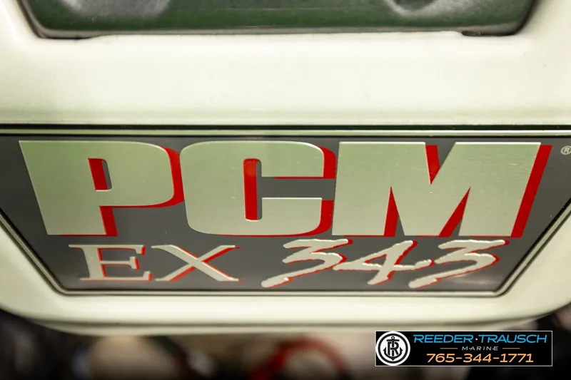 Slide: The Image of Close-up of PCM EX 343 engine label on 2013 Tigé RZR boat. - 22