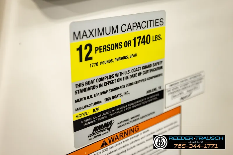 Slide: The Image of 2013 Tigé RZR capacity label, maximum 12 persons or 1740 lbs, safety compliance details. - 57