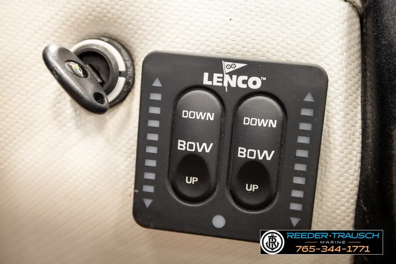 Slide: The Image of Close-up of Lenco trim tab controls on a 2013 Tigé RZR boat. - 34