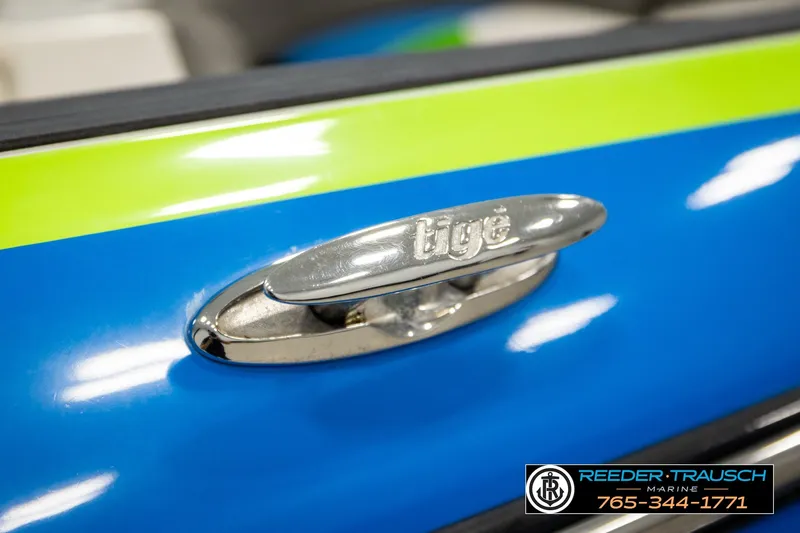 Slide: The Image of Close-up of 2013 Tigé RZR boat cleat on blue and green surface. - 56