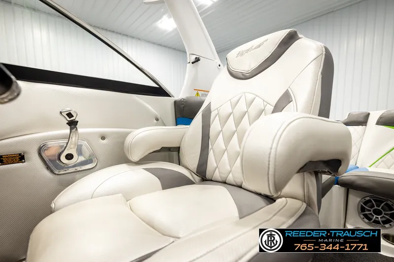 Slide: The Image of 2013 Tigé RZR boat interior with plush seating and modern design. - 38